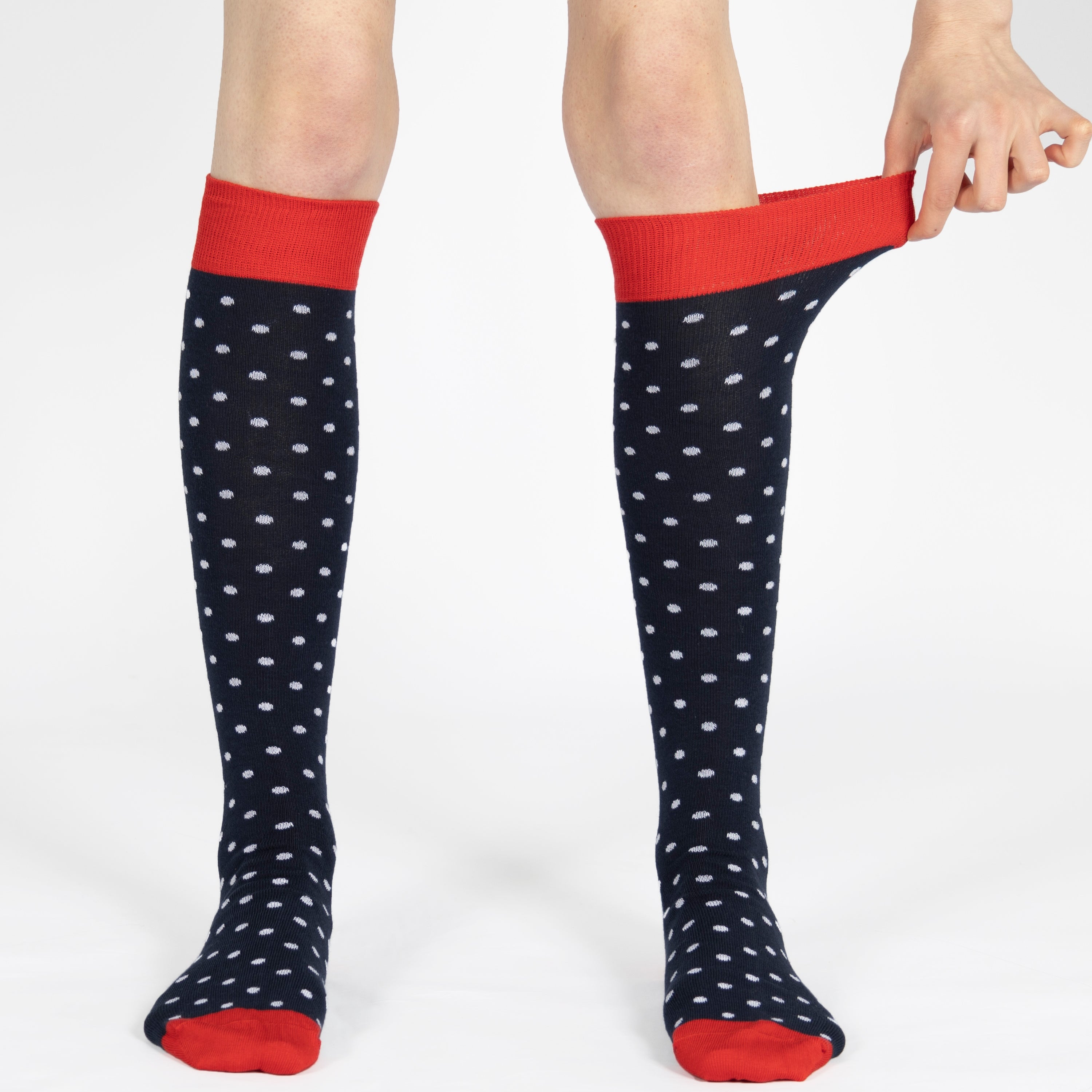 Red knee-high socks with white polka dots