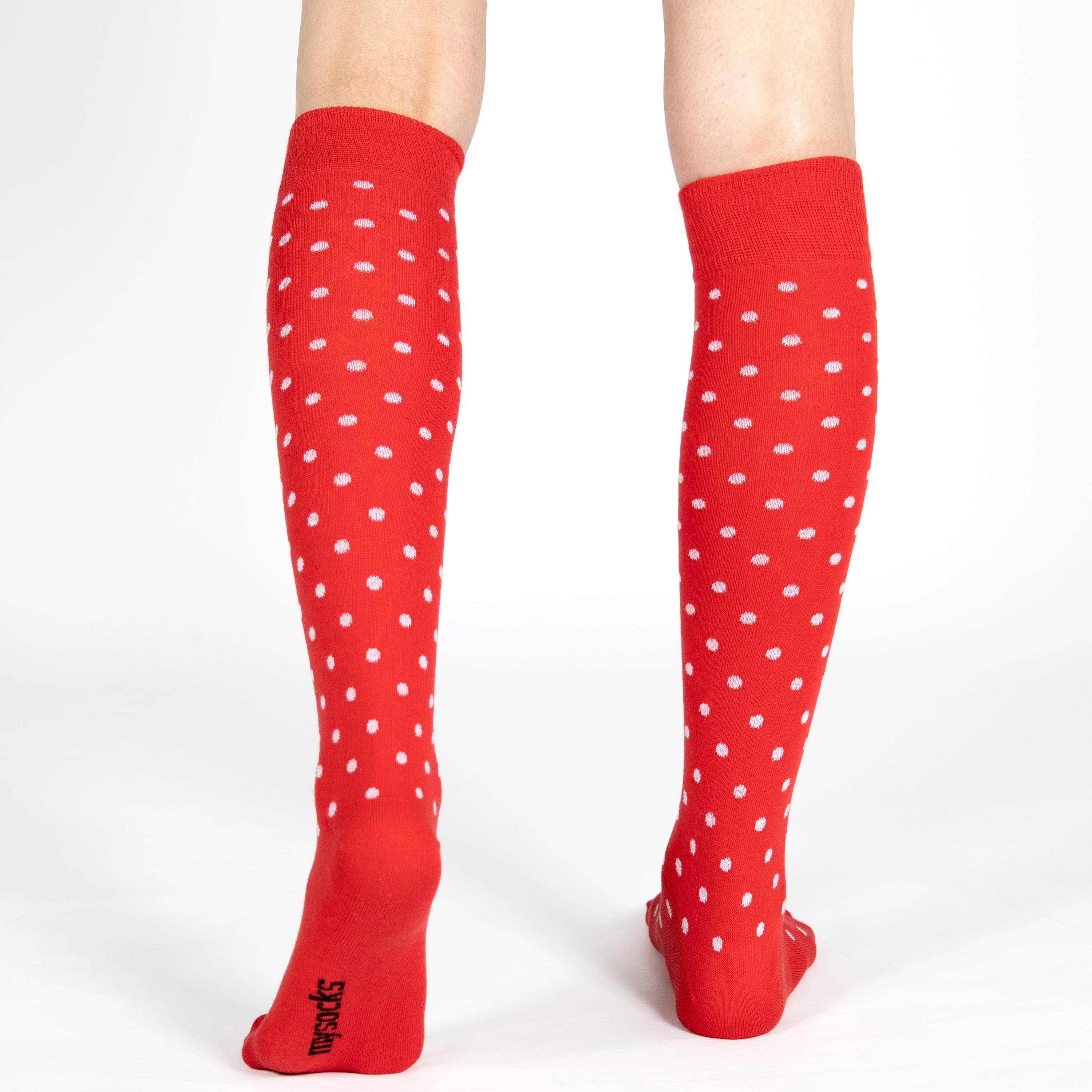 Red knee-high socks with white polka dots