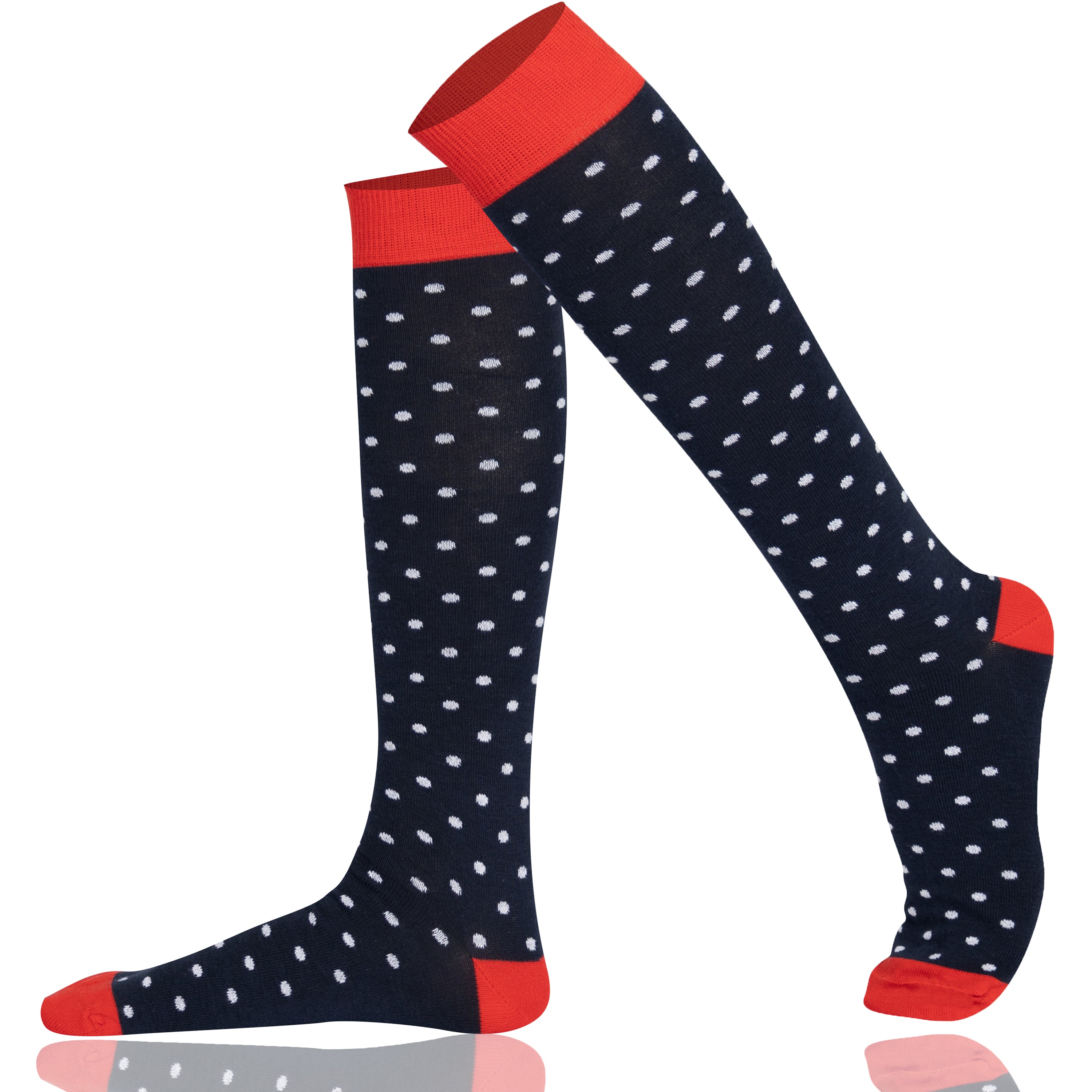 Navy knee-high socks with white polka dots and red accents on a white background