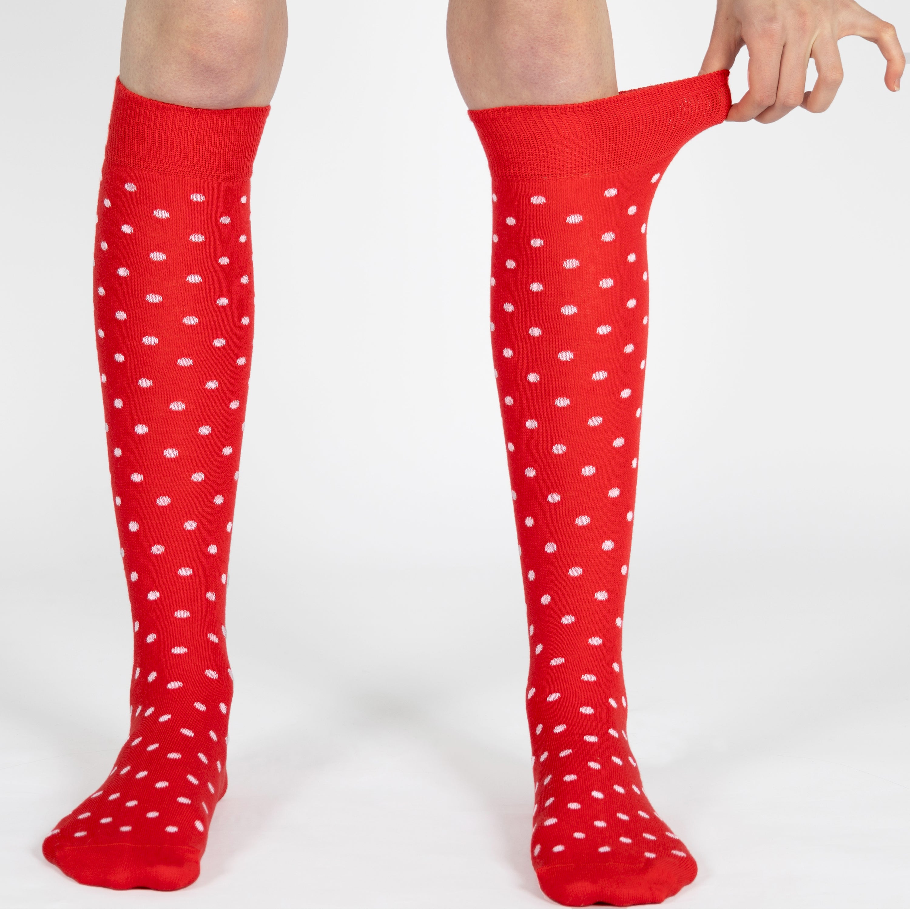 Red knee-high socks with white polka dots
