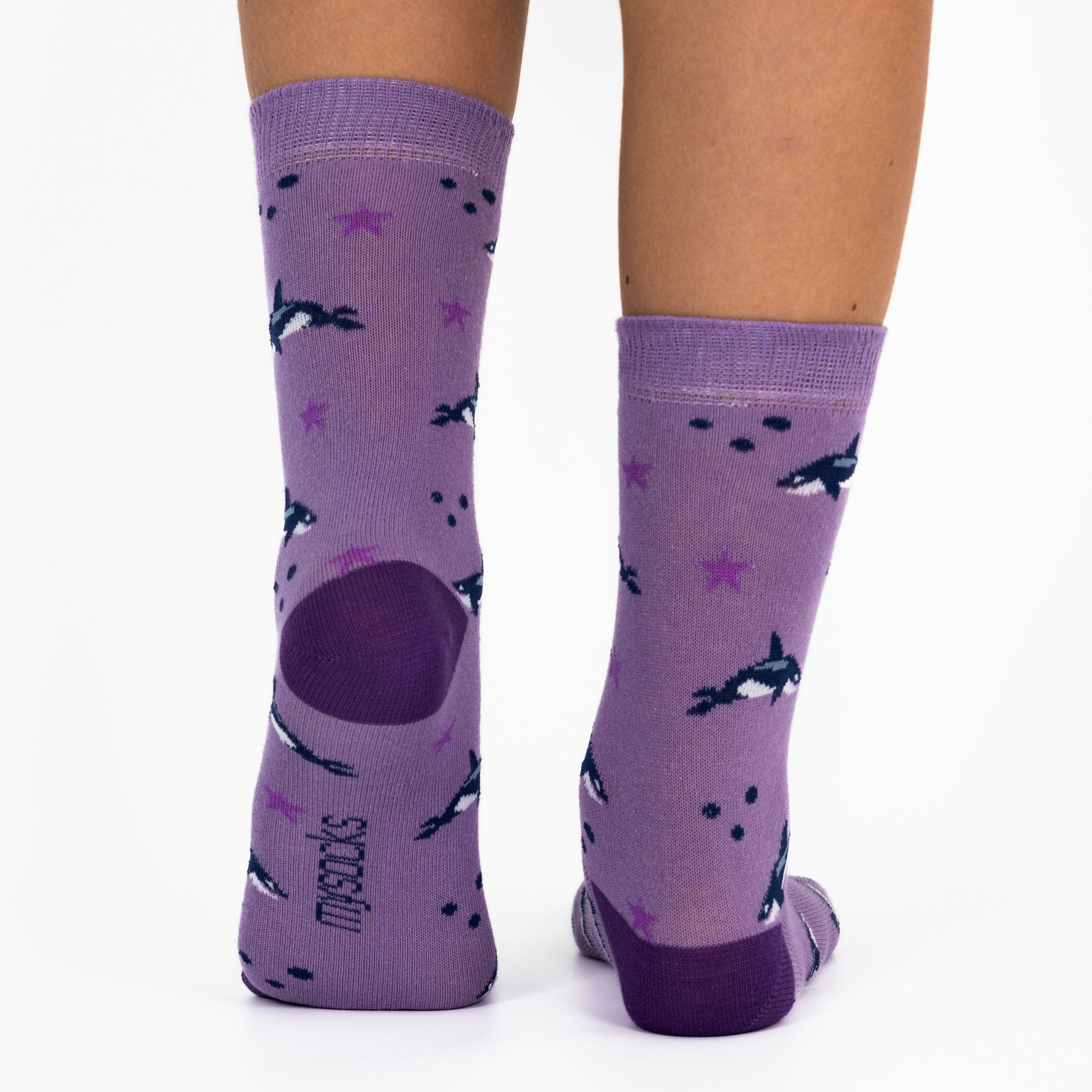 3 pairs of kids fish pattern crew socks in purple and pink with seamless toes.