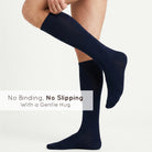 Unisex wearing navy Mysocks knee-high combed cotton socks
