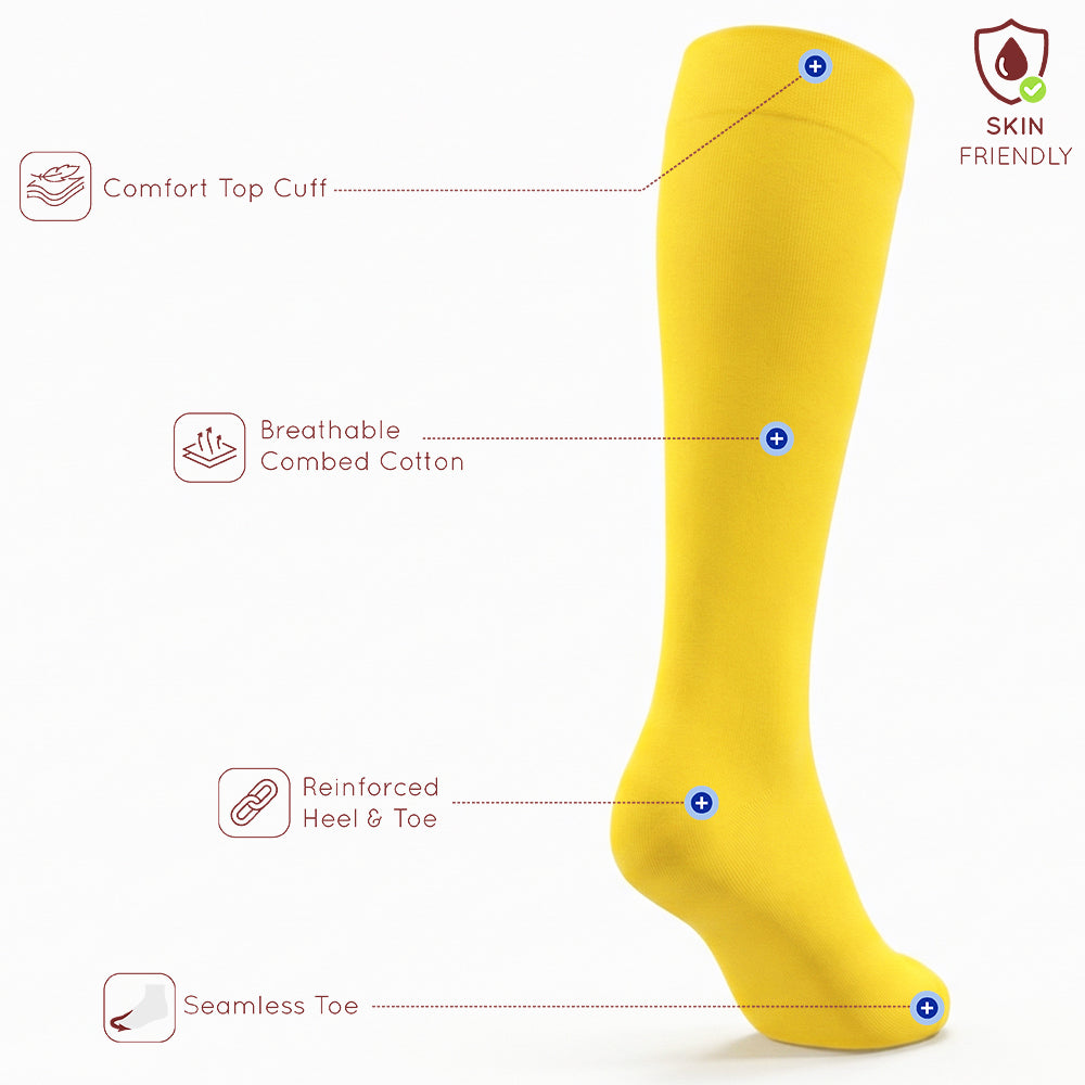 Unisex wearing yellow Mysocks knee-high combed cotton socks