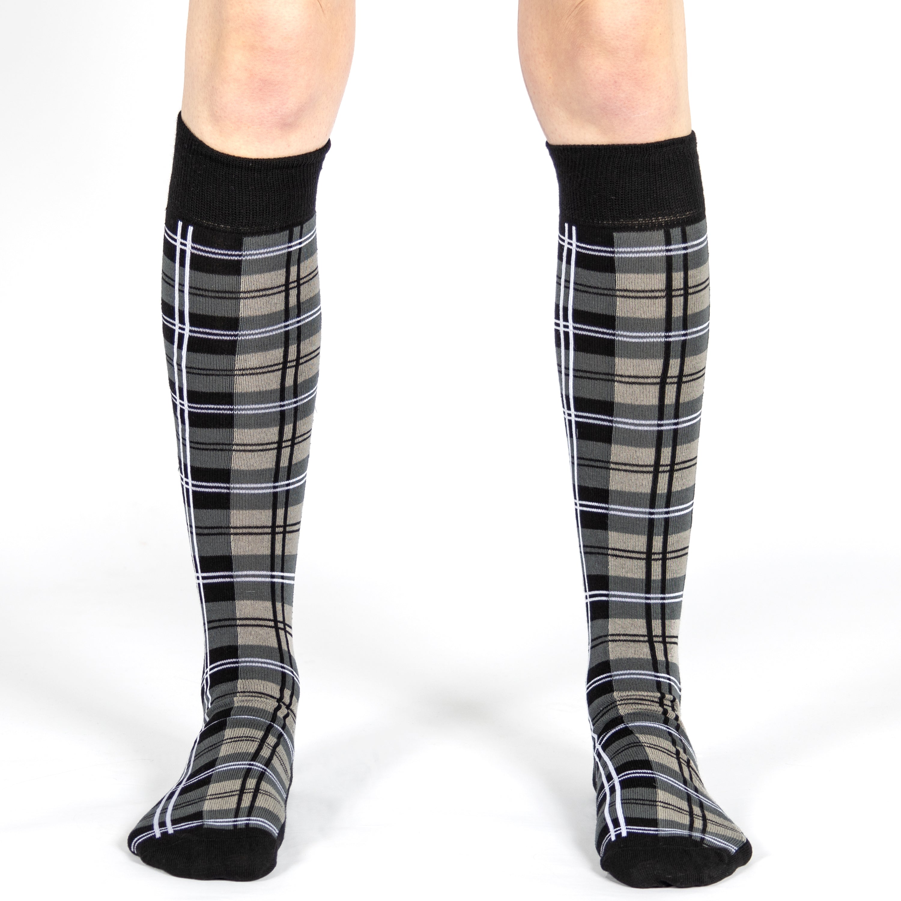 Tartan knee-high socks worn by a person on a white background