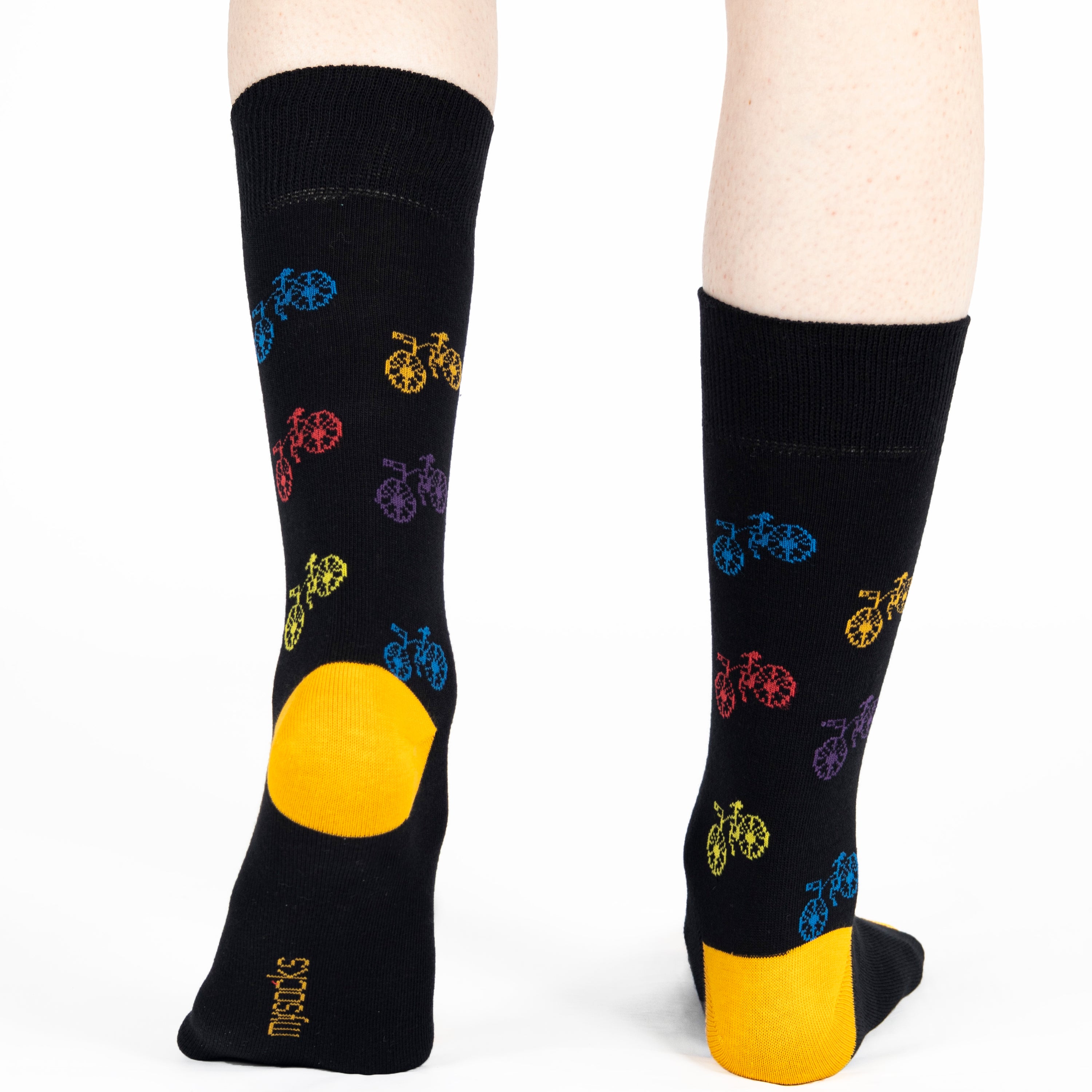black unisex crew socks featuring a brown bicycle pattern and seamless toe design, made from premium combed cotton for men and women