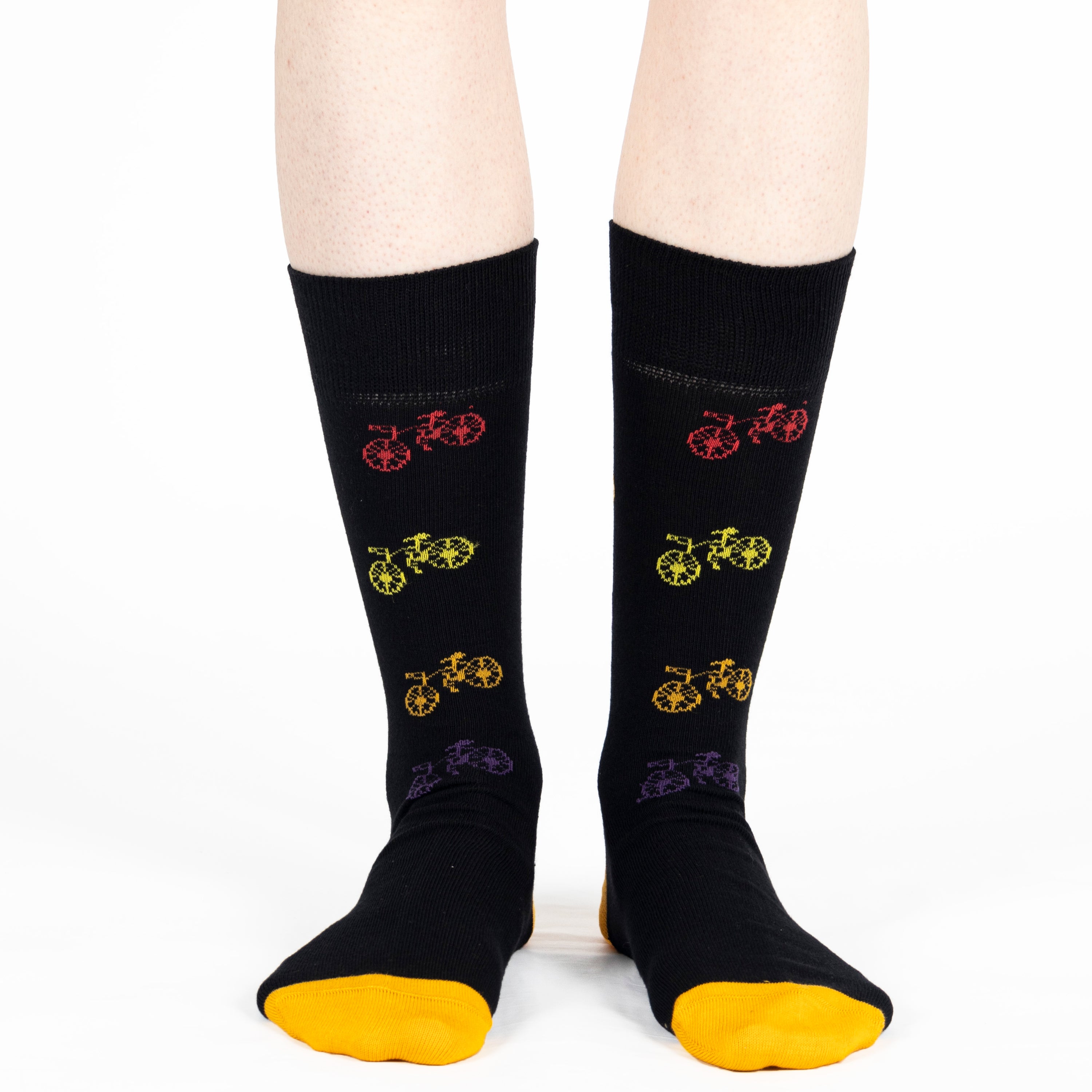 black unisex crew socks featuring a brown bicycle pattern and seamless toe design, made from premium combed cotton for men and women