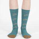 Mint unisex crew socks featuring a brown bicycle pattern and seamless toe design, made from premium combed cotton for men and women