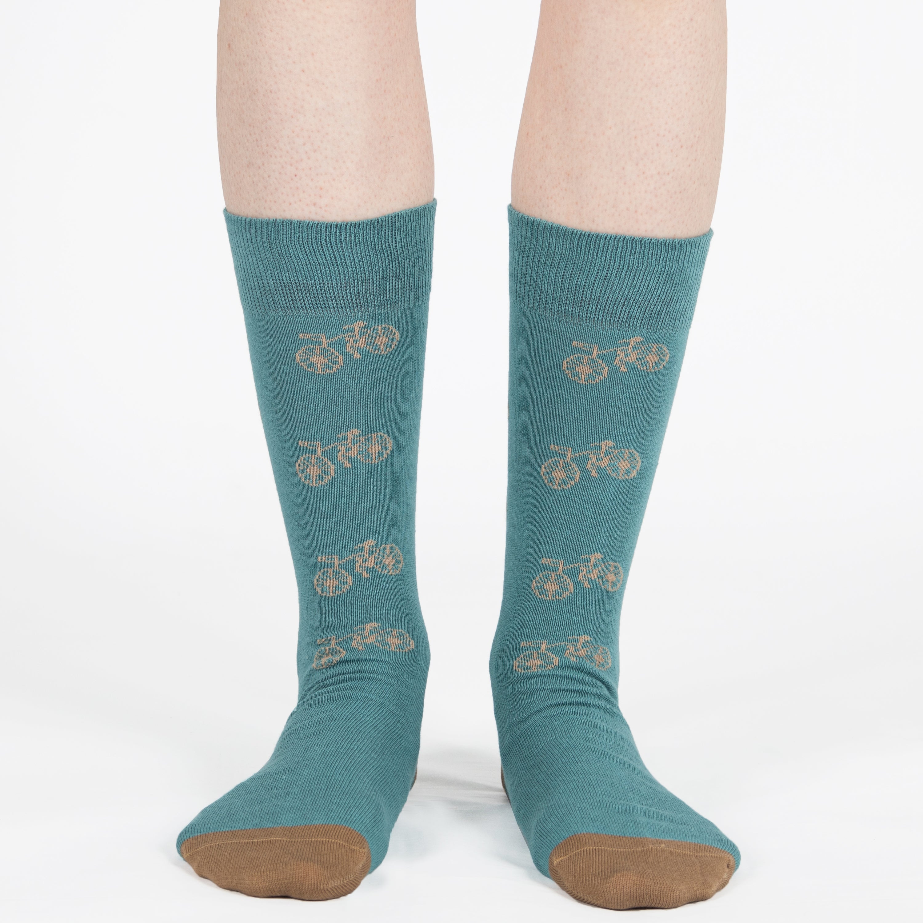 Mint unisex crew socks featuring a brown bicycle pattern and seamless toe design, made from premium combed cotton for men and women