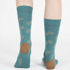 Mint unisex crew socks featuring a brown bicycle pattern and seamless toe design, made from premium combed cotton for men and women