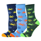 3 pairs of kids crab pattern crew socks in green, blue, and dark green.
