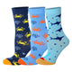 Three pairs of socks with crab and shark patterns on a white background
