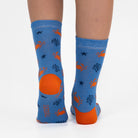 3 pairs of kids crab pattern crew socks in green, blue, and dark green.