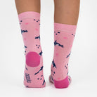 3 pairs of kids fish pattern crew socks in purple and pink with seamless toes.