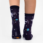 Navy blue socks with space-themed designs on a white background