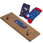 Two pairs of socks with space-themed designs on a cardboard box labeled 'My Socks'.