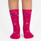 3 pairs of kids fish pattern crew socks in purple and pink with seamless toes.