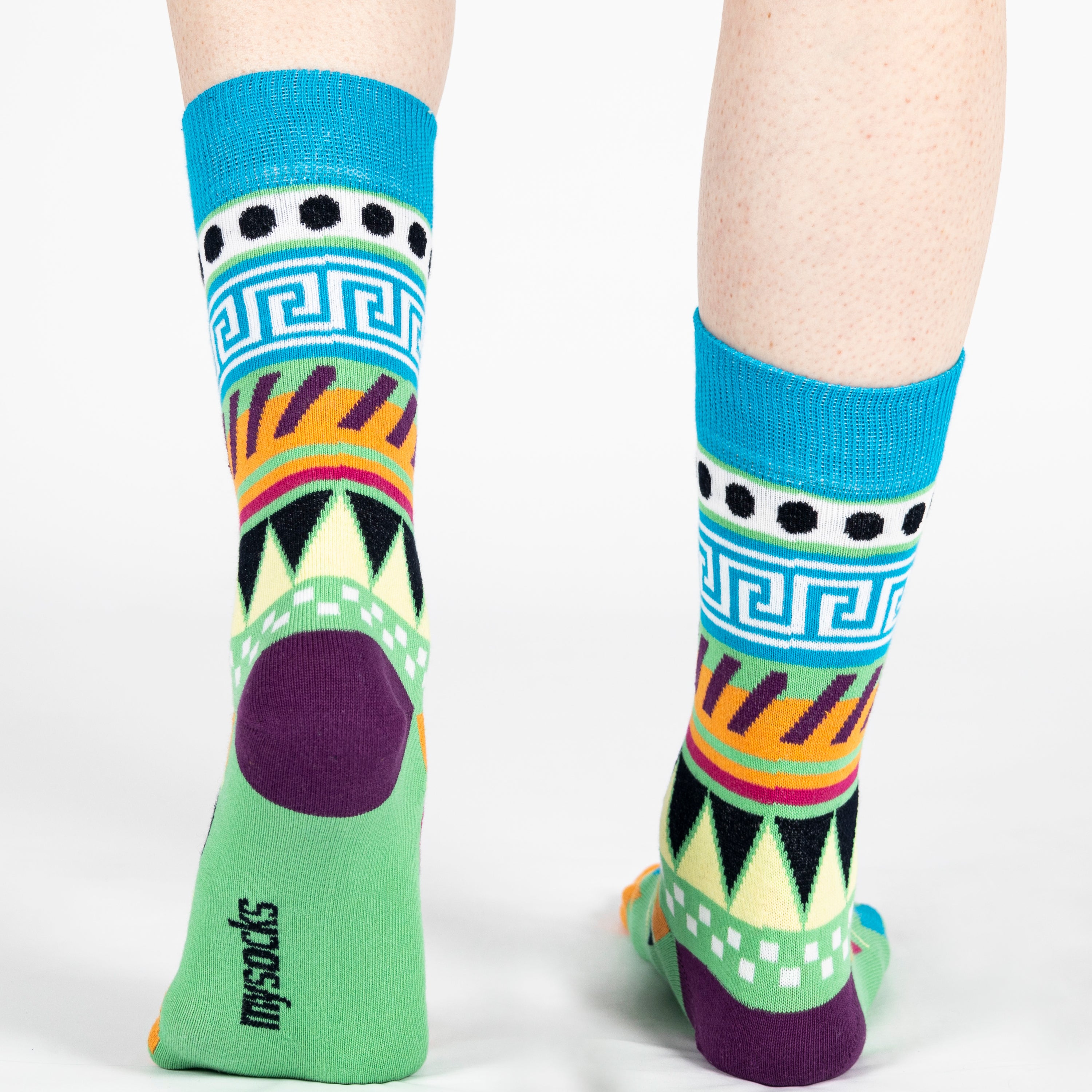 Pair of unisex Mysocks Aztec crew socks featuring vibrant geometric patterns in teal, yellow, and green, displayed on a white background.