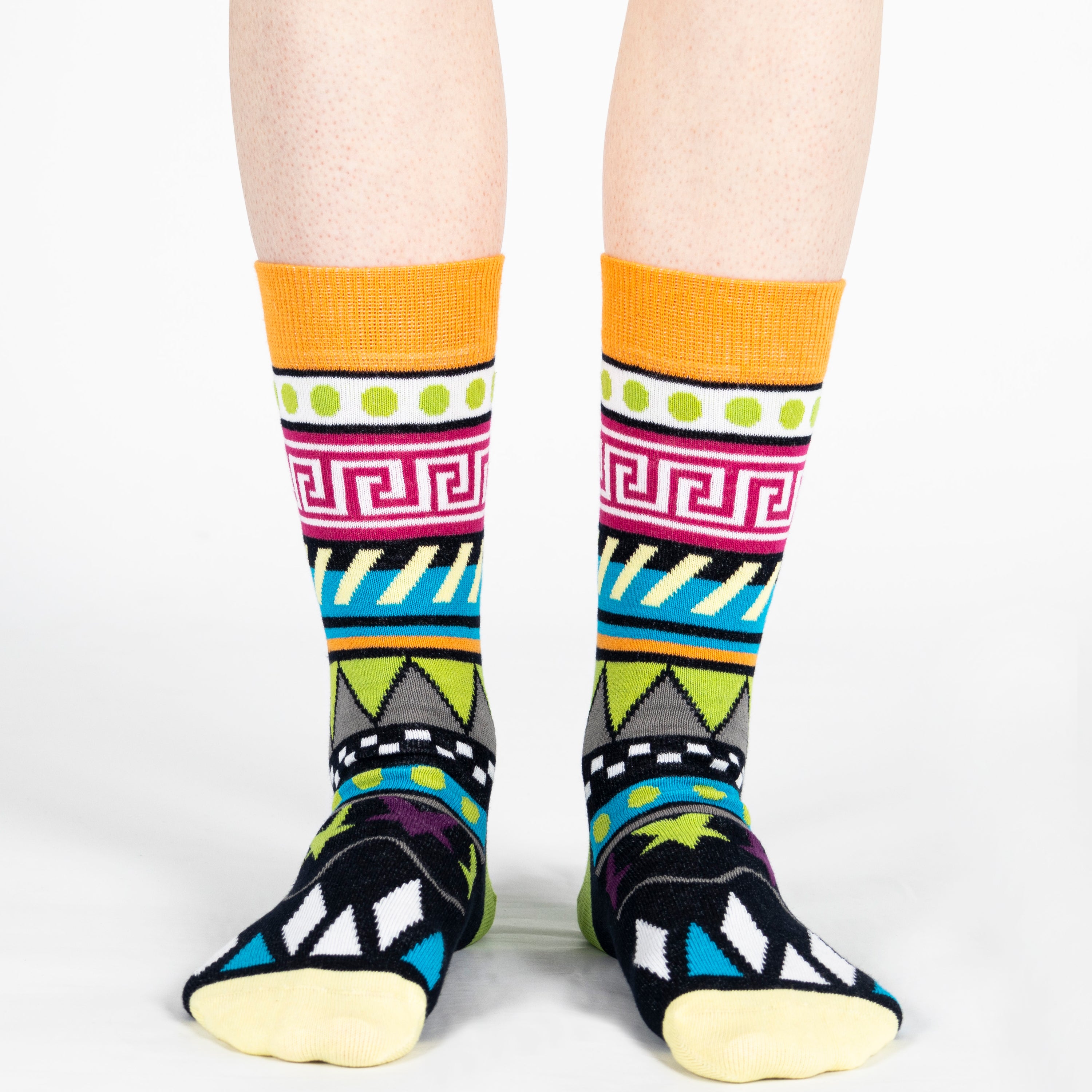 Pair of unisex Mysocks Aztec crew socks featuring vibrant geometric patterns in teal, yellow, and green, displayed on a white background.