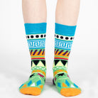 Pair of unisex Mysocks Aztec crew socks featuring vibrant geometric patterns in teal, yellow, and green, displayed on a white background.