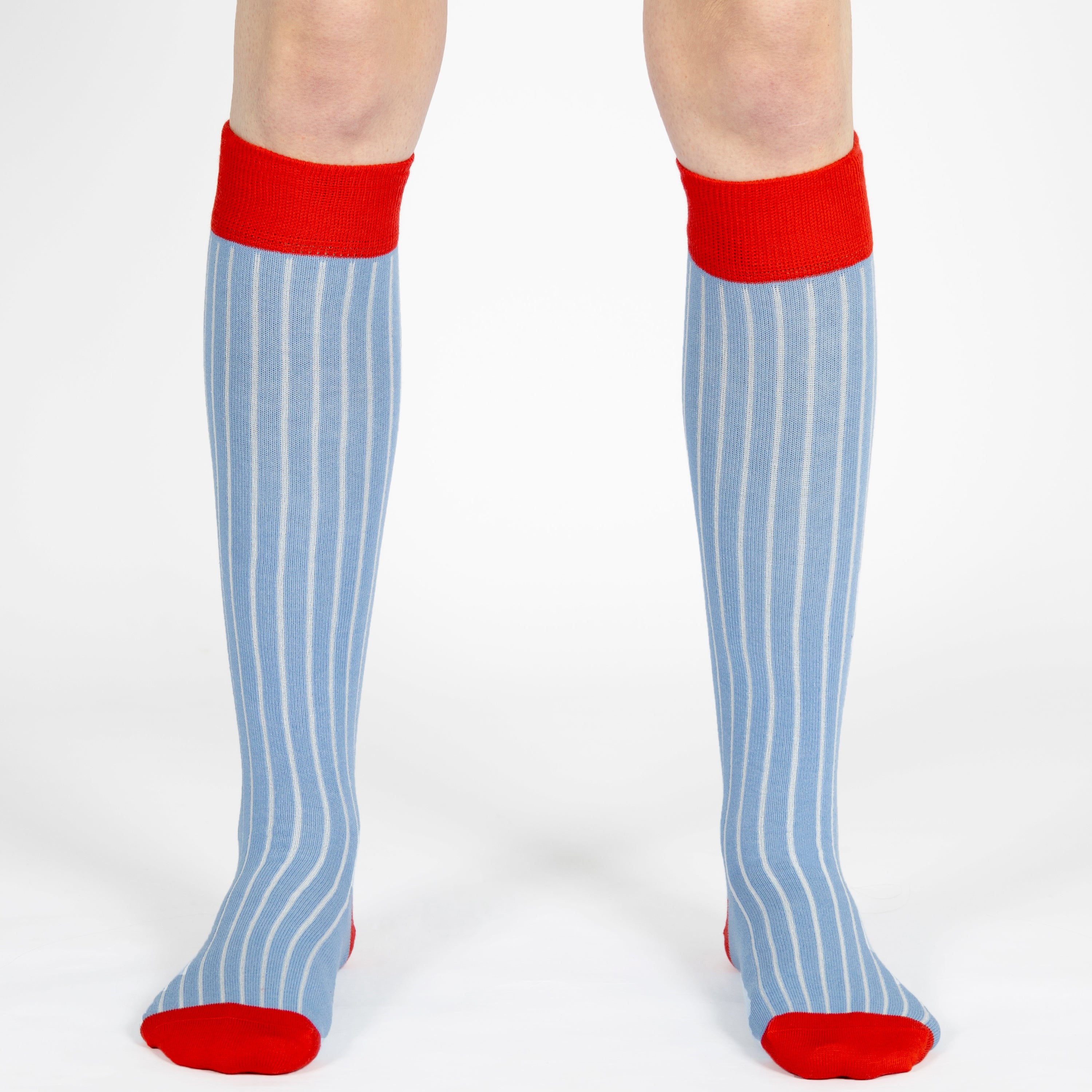 Light blue ribbed kids knee high socks with red cuffs, heels, and a seamless toe by Mysocks.