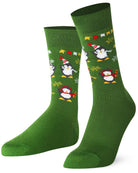 Green socks with penguin design on a white background